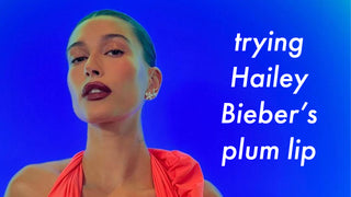 Image of Hailey Bieber with text "trying Hailey Bieber's plum lip" 